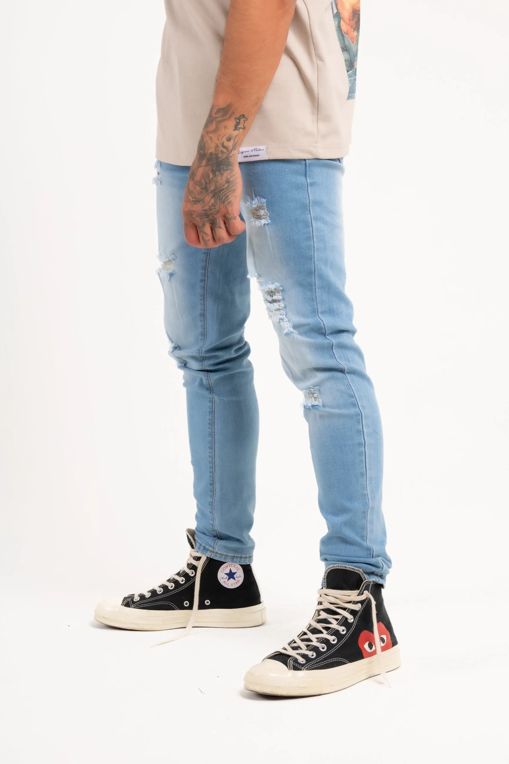 Logan Stretch Skinny Distressed Denim in Indigo Stonewash